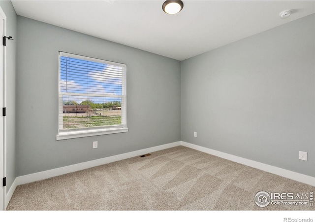 7864 5th St, Wellington, CO 80549 - carpeted empty room with a smoke detector and baseboards