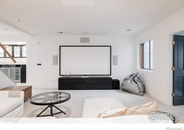 cinema room with carpet and baseboards