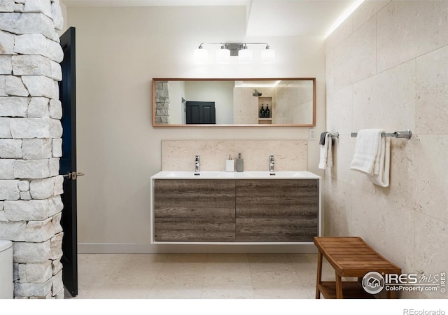 bathroom featuring double vanity