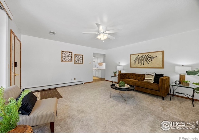 4560 Larkbunting Dr Unit 5D, Fort Collins, CO 80526 - carpeted living room with a baseboard heating unit, ceiling fan, and baseboards