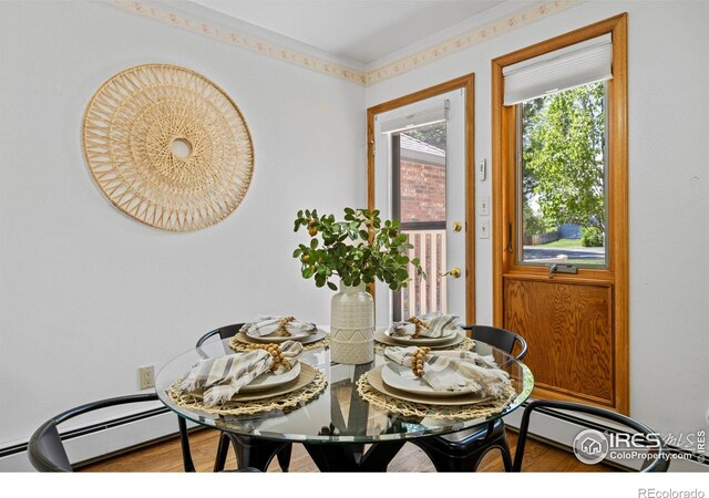 4560 Larkbunting Dr Unit 5D, Fort Collins, CO 80526 - dining room with wood finished floors and a baseboard radiator