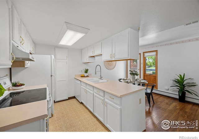 4560 Larkbunting Dr Unit 5D, Fort Collins, CO 80526 - kitchen featuring a sink, white appliances, under cabinet range hood, white cabinets, and light countertops