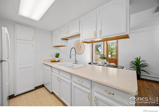 4560 Larkbunting Dr Unit 5D, Fort Collins, CO 80526 - kitchen featuring a sink, white appliances, and white cabinets
