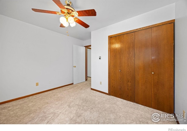 4560 Larkbunting Dr Unit 5D, Fort Collins, CO 80526 - unfurnished bedroom with carpet, a closet, baseboards, and ceiling fan