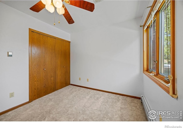 4560 Larkbunting Dr Unit 5D, Fort Collins, CO 80526 - unfurnished bedroom with carpet, a closet, a baseboard heating unit, a ceiling fan, and baseboards