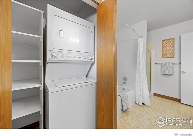 4560 Larkbunting Dr Unit 5D, Fort Collins, CO 80526 - washroom with stacked washer / drying machine and baseboards