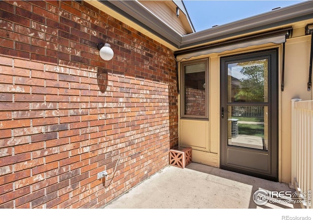 4560 Larkbunting Dr Unit 5D, Fort Collins, CO 80526 - view of exterior entry with brick siding