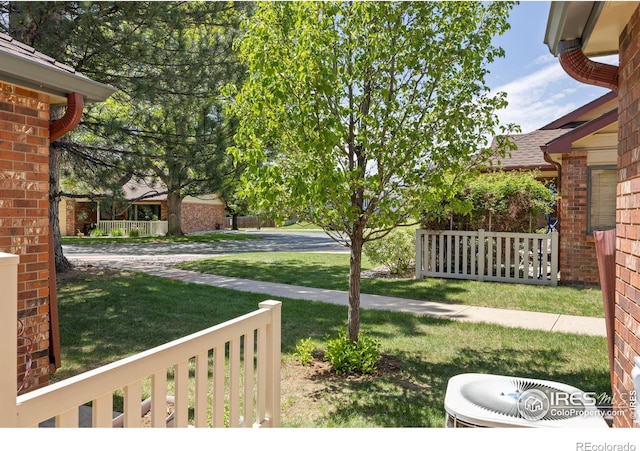 4560 Larkbunting Dr Unit 5D, Fort Collins, CO 80526 - view of grassy yard with cooling unit and a porch