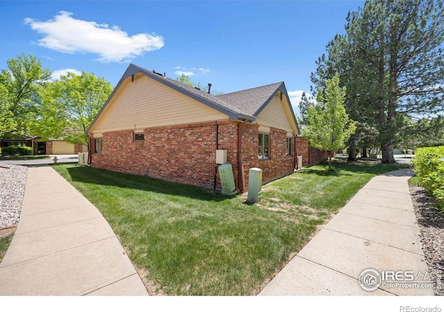 4560 Larkbunting Dr Unit 5D, Fort Collins, CO 80526 - view of property exterior with brick siding and a lawn