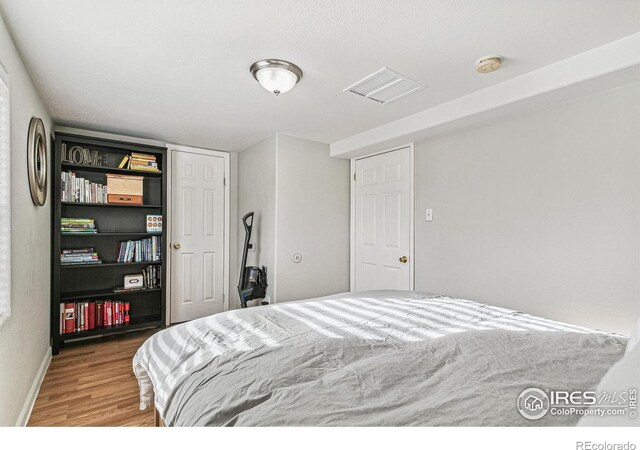 1970 Willow St, Denver, CO 80220 - bedroom with wood finished floors and baseboards