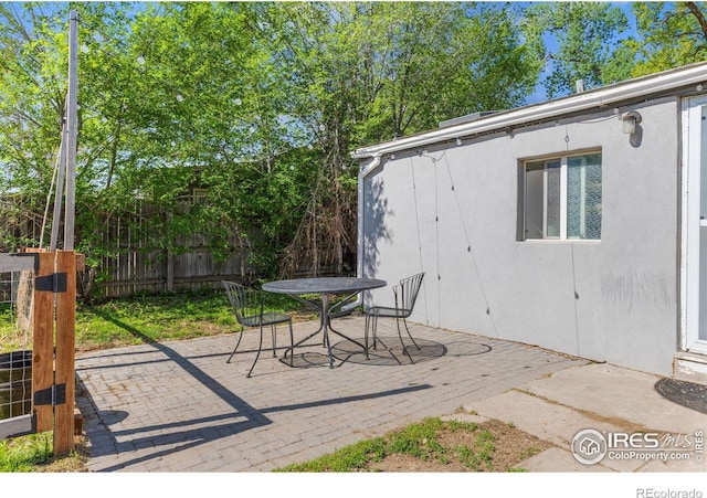 1970 Willow St, Denver, CO 80220 - view of patio / terrace featuring fence and outdoor dining space