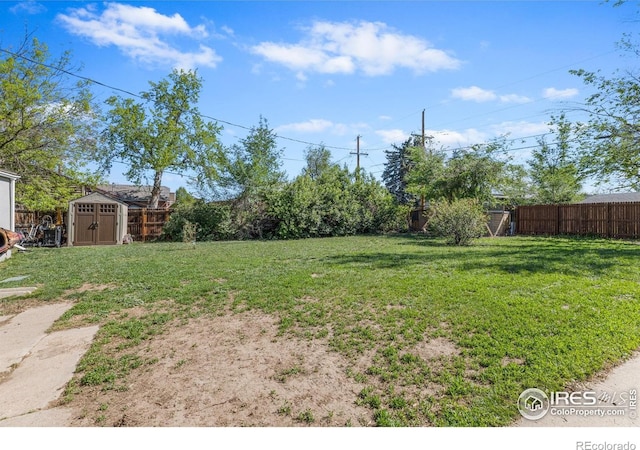 1970 Willow St, Denver, CO 80220 - view of yard featuring a storage unit and an outbuilding