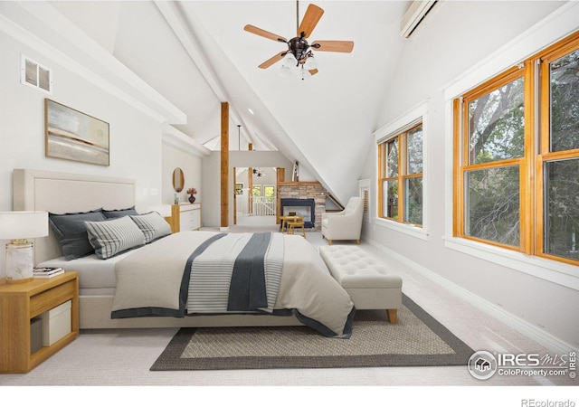 bedroom with baseboards, a fireplace, and light carpet