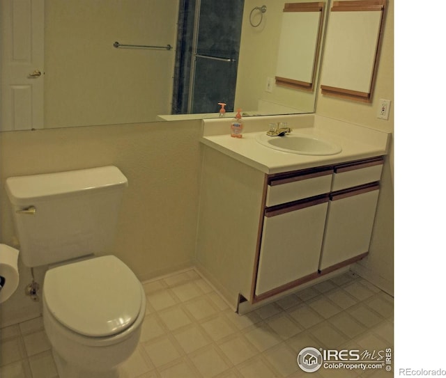 33 S Boulder Cir Unit 122, Boulder, CO 80303 - bathroom featuring vanity, toilet, and tile patterned floors