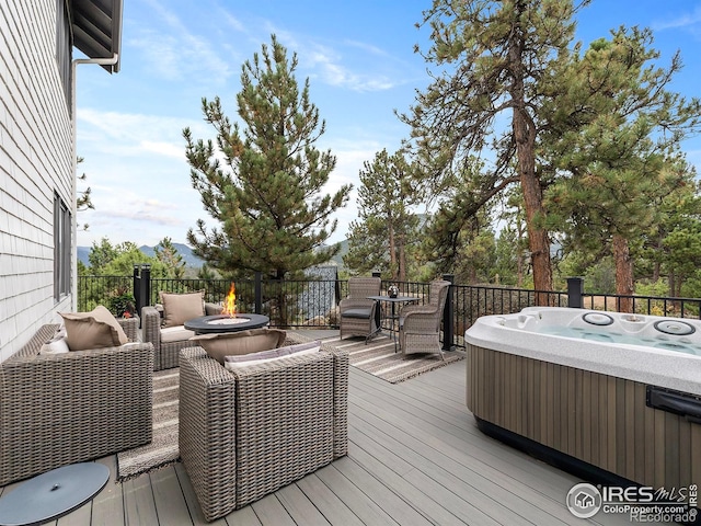 370 Big Boulder Dr, Estes Park, CO 80517 - wooden deck with a hot tub and a fire pit