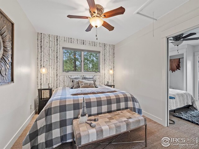 370 Big Boulder Dr, Estes Park, CO 80517 - bedroom featuring attic access, baseboards, wallpapered walls, a ceiling fan, and carpet
