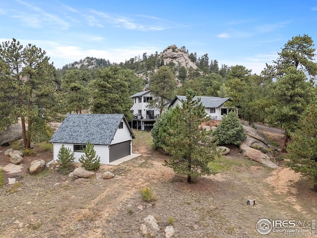 370 Big Boulder Dr, Estes Park, CO 80517 - view of home's exterior with an outdoor structure and a detached garage