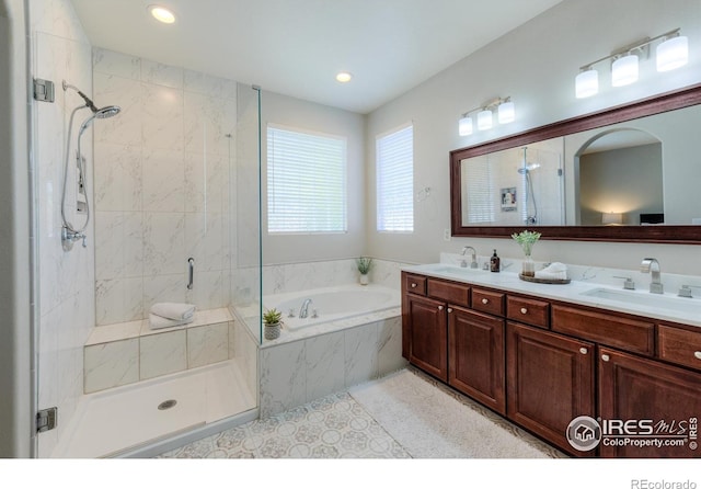 489 Hayloft Way, Brighton, CO 80601 - bathroom with a garden tub, a stall shower, double vanity, recessed lighting, and tile patterned flooring