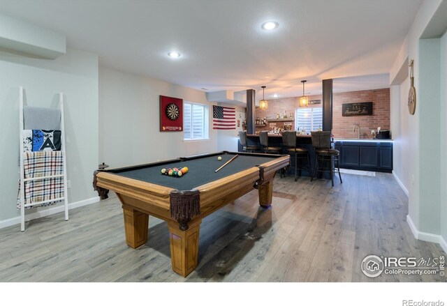 489 Hayloft Way, Brighton, CO 80601 - playroom featuring wet bar, light wood-style flooring, pool table, baseboards, and recessed lighting