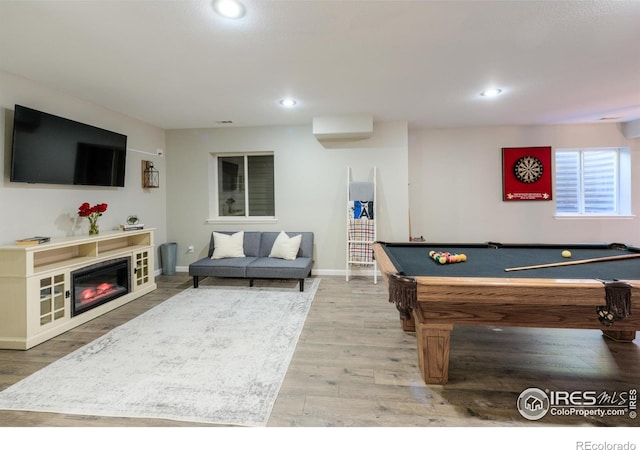 489 Hayloft Way, Brighton, CO 80601 - playroom with wood finished floors, recessed lighting, baseboards, billiards table, and a glass covered fireplace
