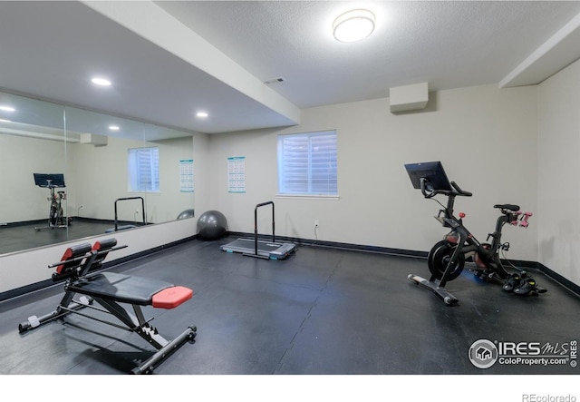 489 Hayloft Way, Brighton, CO 80601 - workout room with baseboards, recessed lighting, and a textured ceiling