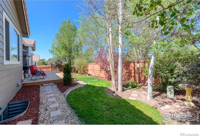 489 Hayloft Way, Brighton, CO 80601 - view of yard with a deck