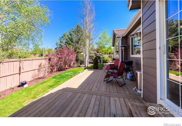489 Hayloft Way, Brighton, CO 80601 - deck with a fenced backyard