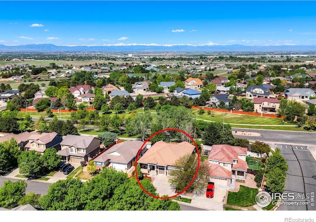 489 Hayloft Way, Brighton, CO 80601 - aerial view of residential area featuring a mountain backdrop