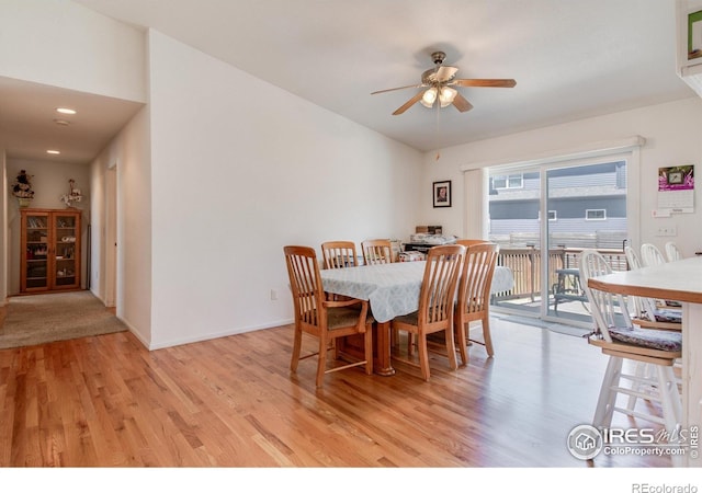 10007 E County Line Rd, Longmont, CO 80501 - dining area featuring light wood-style flooring, a ceiling fan, baseboards, and lofted ceiling