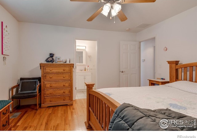 10007 E County Line Rd, Longmont, CO 80501 - bedroom featuring light wood finished floors, ensuite bath, and ceiling fan