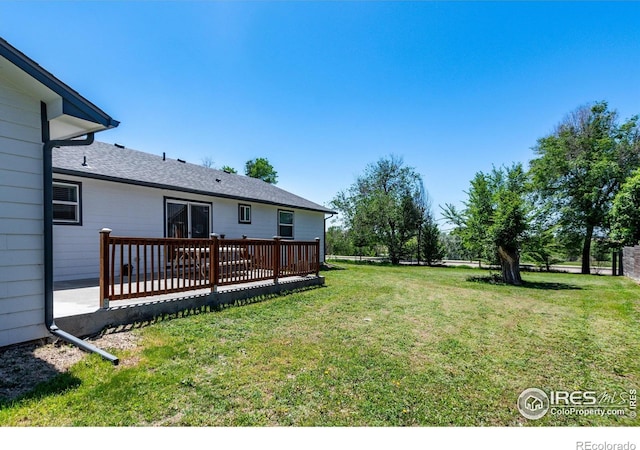 10007 E County Line Rd, Longmont, CO 80501 - view of grassy yard featuring a deck