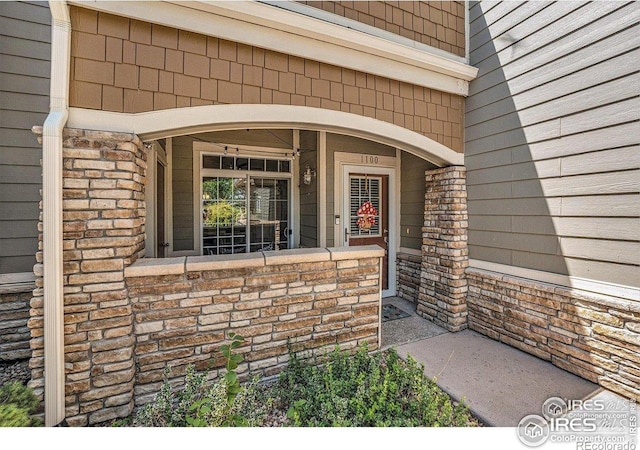 entrance to property with covered porch
