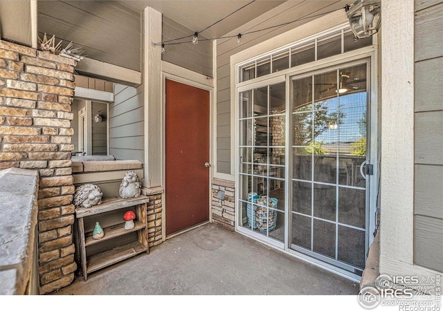 view of exterior entry featuring a porch