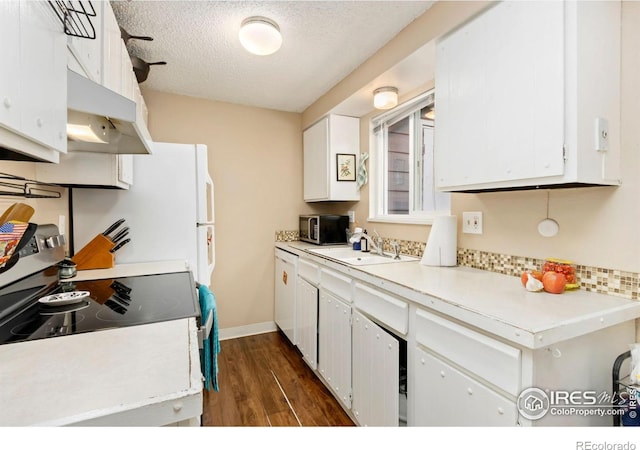 2709 Harvard St Unit 3, Fort Collins, CO 80525 - kitchen with a sink, stainless steel microwave, under cabinet range hood, white cabinets, and a textured ceiling