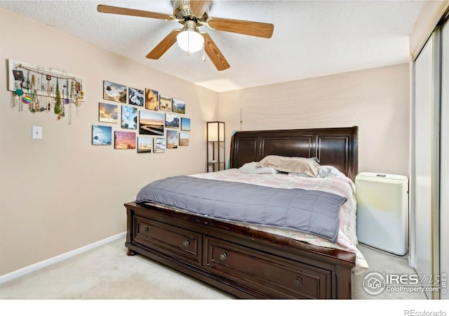 2709 Harvard St Unit 3, Fort Collins, CO 80525 - bedroom featuring light colored carpet, baseboards, a ceiling fan, and a closet