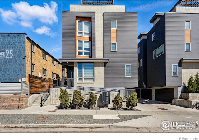 2625 W 25th Ave Unit 7, Denver, CO 80211 - contemporary house with fence and stairway