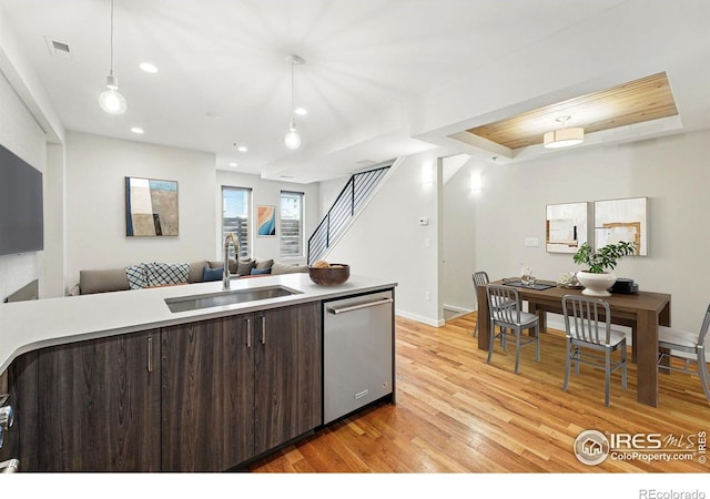 2625 W 25th Ave Unit 7, Denver, CO 80211 - kitchen with dishwasher, a sink, dark brown cabinets, light wood-style flooring, and open floor plan