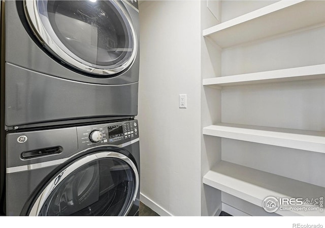 2625 W 25th Ave Unit 7, Denver, CO 80211 - clothes washing area featuring stacked washer / drying machine and baseboards