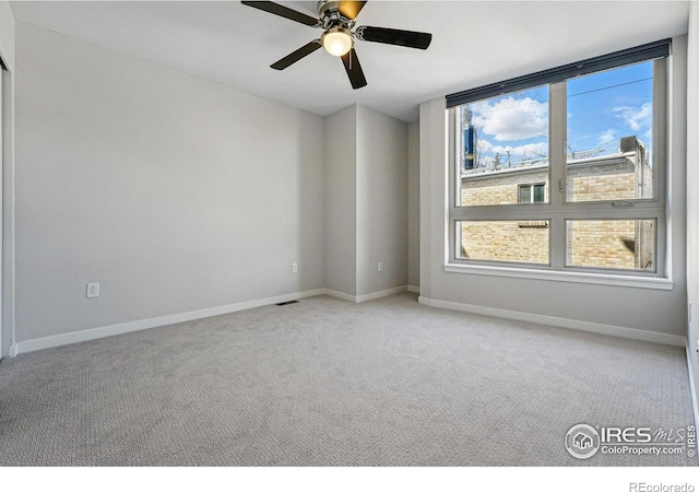 2625 W 25th Ave Unit 7, Denver, CO 80211 - spare room with carpet floors, baseboards, and ceiling fan