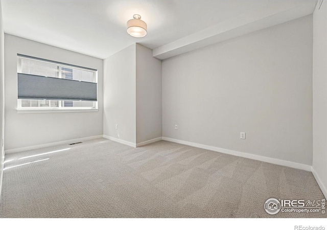 2625 W 25th Ave Unit 7, Denver, CO 80211 - carpeted spare room featuring baseboards