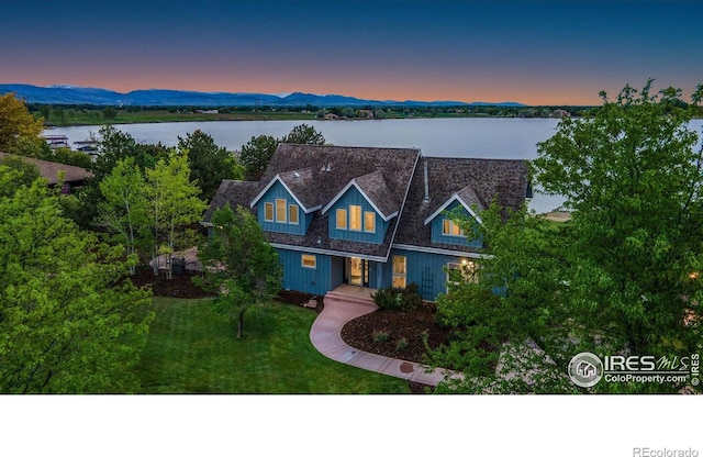 10481 Oxford Rd, Longmont, CO 80504 - view of front of home featuring a water view and a front yard