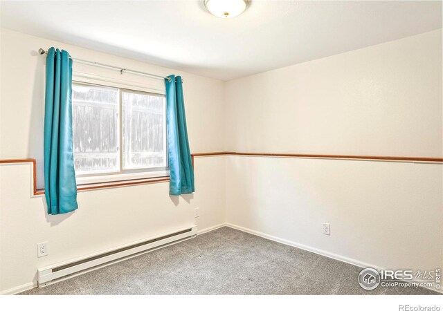 821 Hayden Ct, Longmont, CO 80503 - carpeted spare room featuring a baseboard heating unit and baseboards