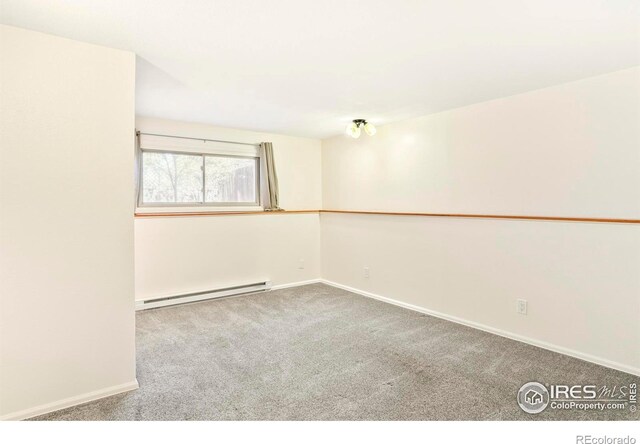 821 Hayden Ct, Longmont, CO 80503 - carpeted empty room with a baseboard heating unit and baseboards