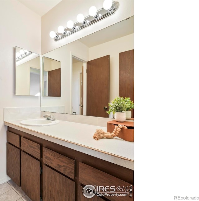 821 Hayden Ct, Longmont, CO 80503 - bathroom featuring vanity and tile patterned flooring