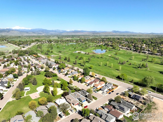 821 Hayden Ct, Longmont, CO 80503 - aerial view of property's location with a water and mountain view, nearby suburban area, and a local golf course