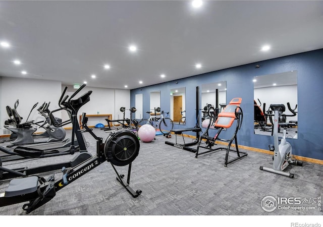 exercise room with recessed lighting and baseboards