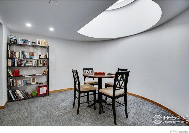 carpeted dining area featuring baseboards and recessed lighting