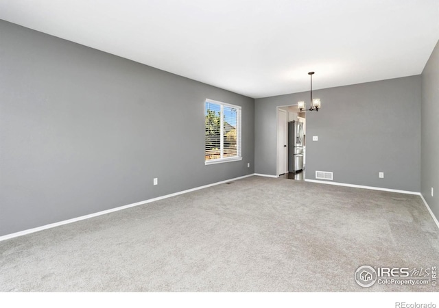 3227 Honeysuckle Ct, Fort Collins, CO 80521 - carpeted spare room with baseboards and a chandelier