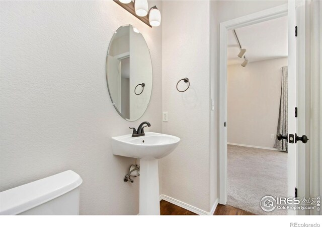 3227 Honeysuckle Ct, Fort Collins, CO 80521 - bathroom featuring toilet and baseboards
