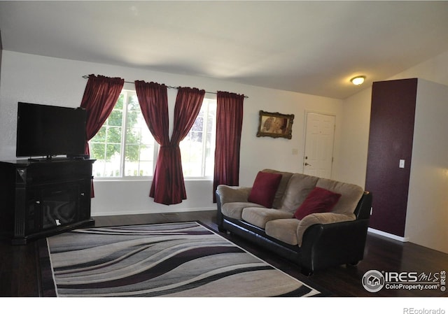 living room with wood finished floors and baseboards